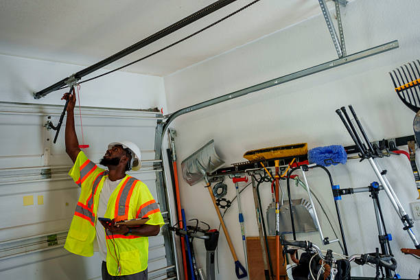 Professional Garage Door Panel Replacement technician working in Walls, MS
